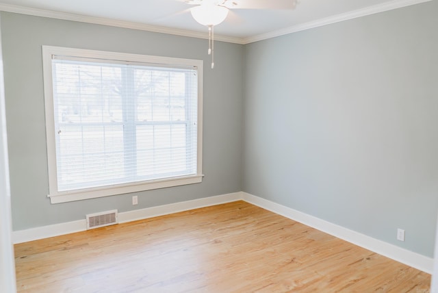 unfurnished room featuring ceiling fan, wood-type flooring, and crown molding