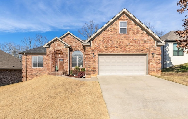 view of front property with a garage and a front lawn