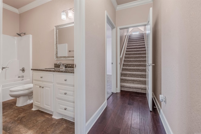 full bathroom with shower / bath combination, ornamental molding, vanity, and toilet