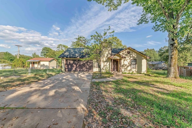 view of front facade featuring a front yard and a garage