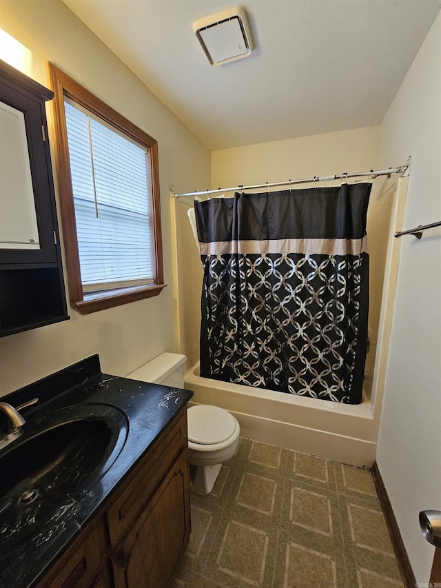 full bathroom featuring vanity, toilet, and shower / tub combo with curtain