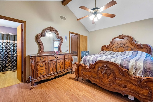 bedroom featuring lofted ceiling with beams, light hardwood / wood-style floors, and ceiling fan