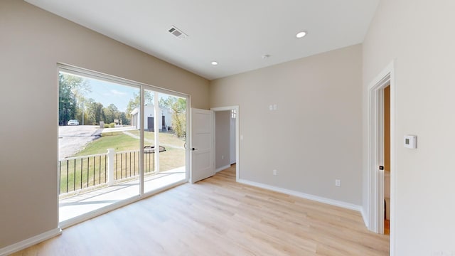 empty room with light hardwood / wood-style floors