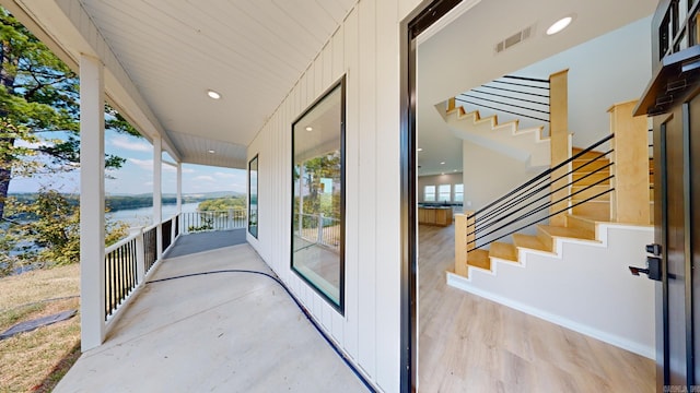 view of patio featuring a water view