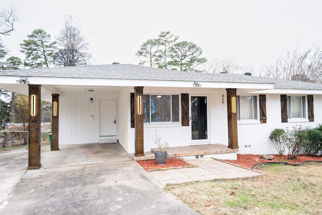 view of front of home featuring a carport