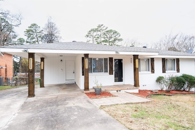 ranch-style home featuring a carport