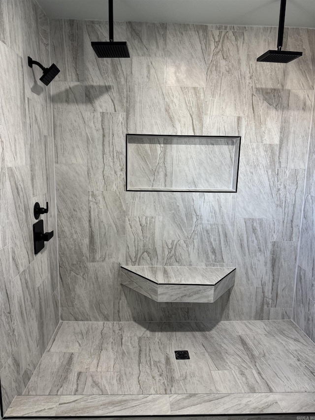 bathroom featuring a tile shower