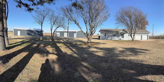 view of yard featuring a garage