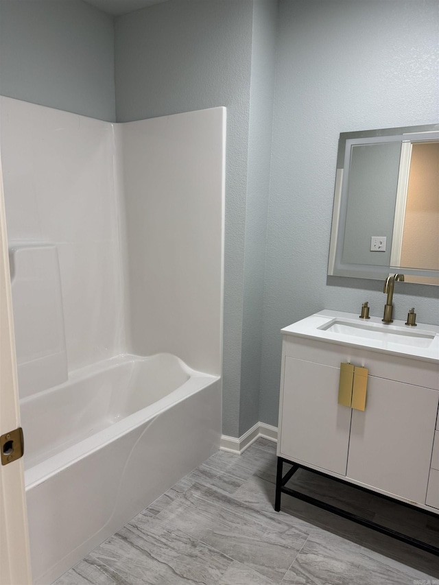 bathroom featuring vanity and shower / bath combination