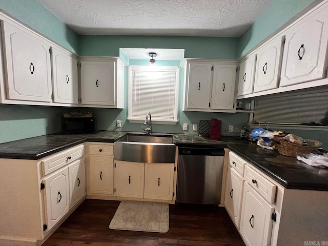 kitchen featuring dishwasher, white cabinetry, and sink