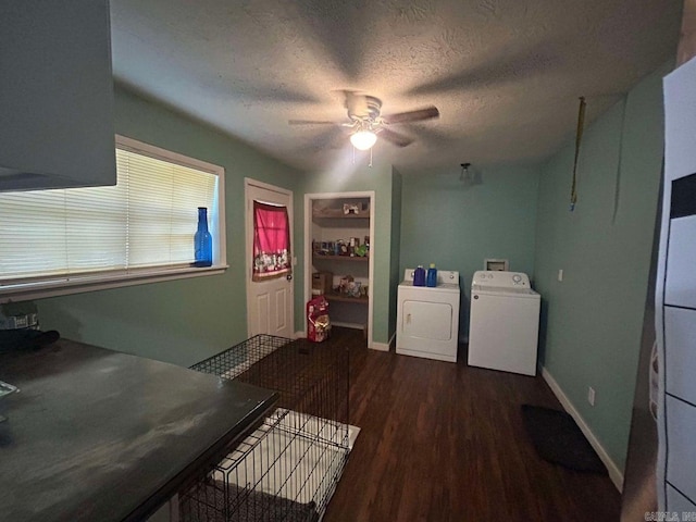 laundry room with dark hardwood / wood-style flooring, a textured ceiling, washer and clothes dryer, and ceiling fan