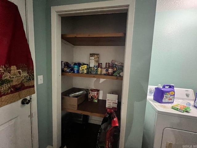 pantry with washing machine and clothes dryer