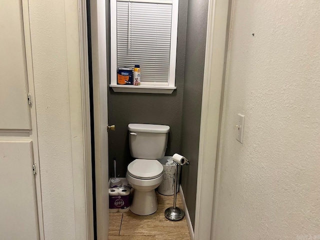 bathroom featuring tile patterned floors and toilet