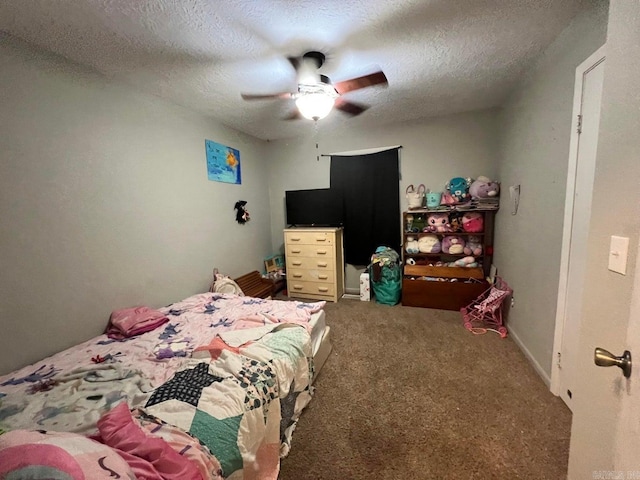 carpeted bedroom featuring ceiling fan and a textured ceiling