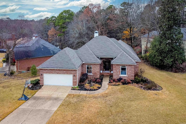 view of front of property with a front yard and a garage