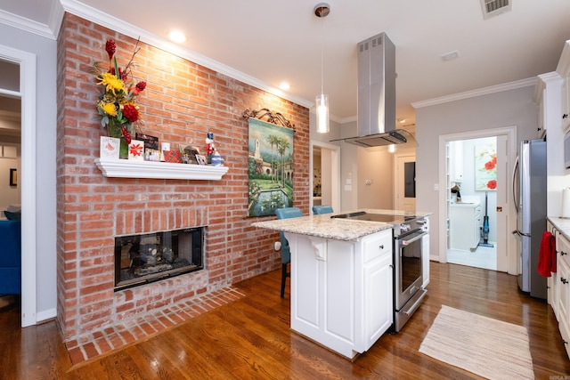 kitchen featuring light stone countertops, white cabinets, stainless steel appliances, island range hood, and a center island with sink