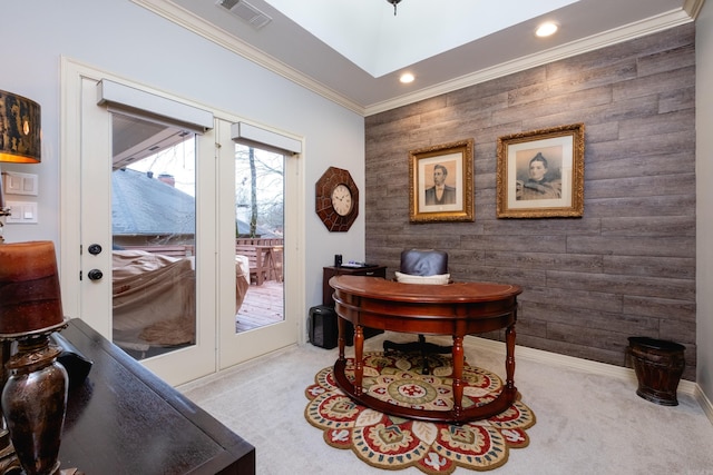 office space featuring wood walls, light colored carpet, and ornamental molding