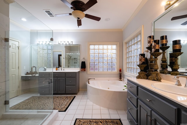 bathroom featuring tile patterned floors, vanity, ornamental molding, and shower with separate bathtub