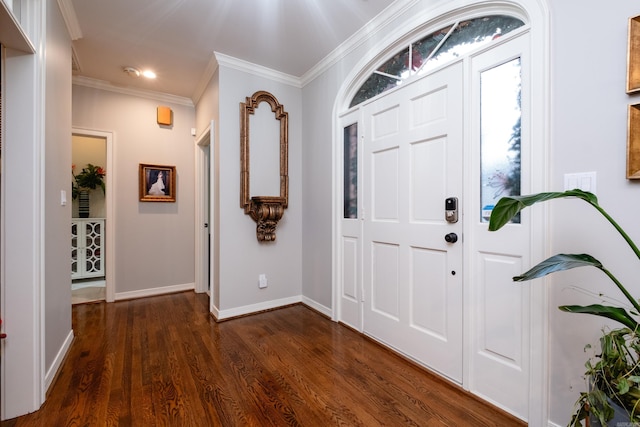 foyer entrance with dark hardwood / wood-style flooring and crown molding