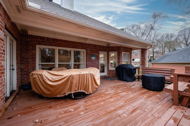 wooden terrace featuring grilling area