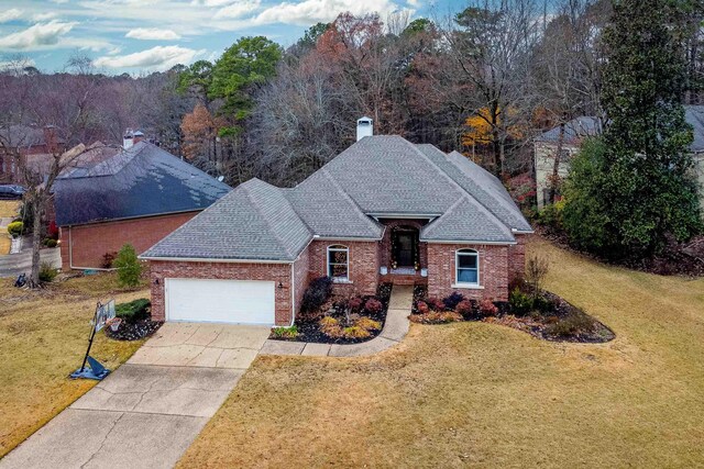 view of front of property with a garage and a front yard