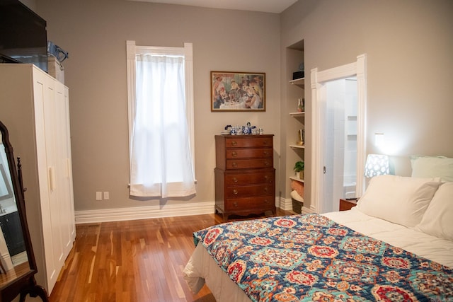 bedroom featuring hardwood / wood-style floors