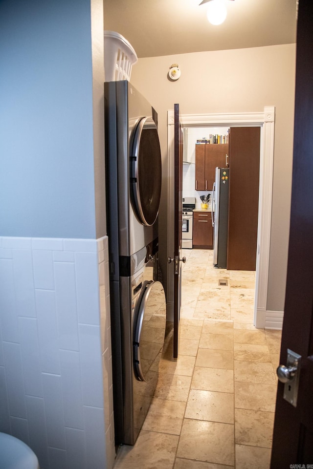 laundry area featuring stacked washer and dryer