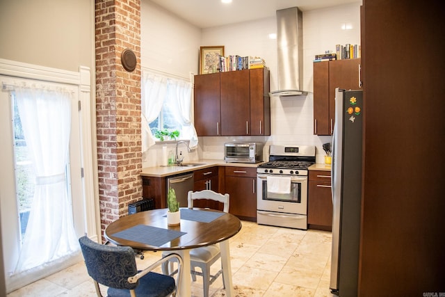 kitchen with backsplash, stainless steel appliances, plenty of natural light, and wall chimney range hood