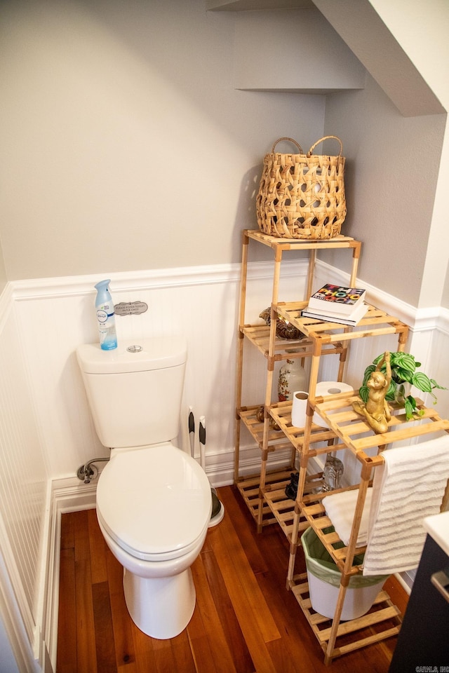 bathroom featuring hardwood / wood-style floors and toilet