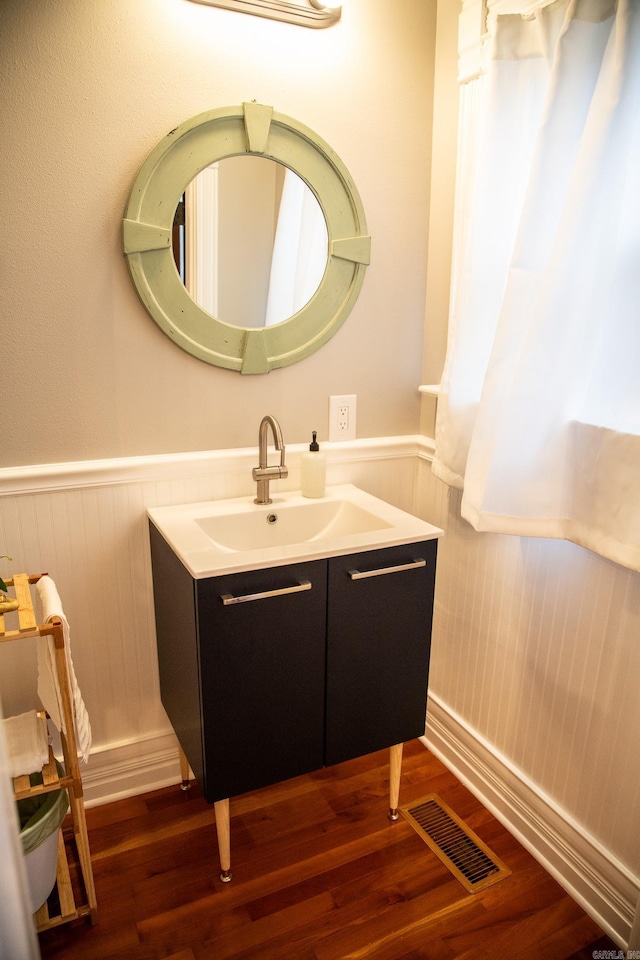 bathroom with wood-type flooring and vanity