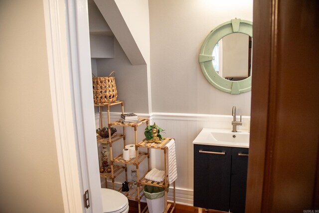 bathroom featuring vanity and toilet