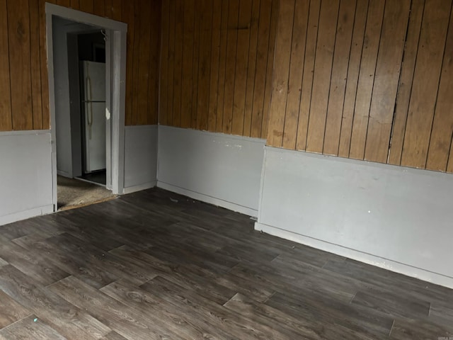 empty room featuring dark wood-type flooring