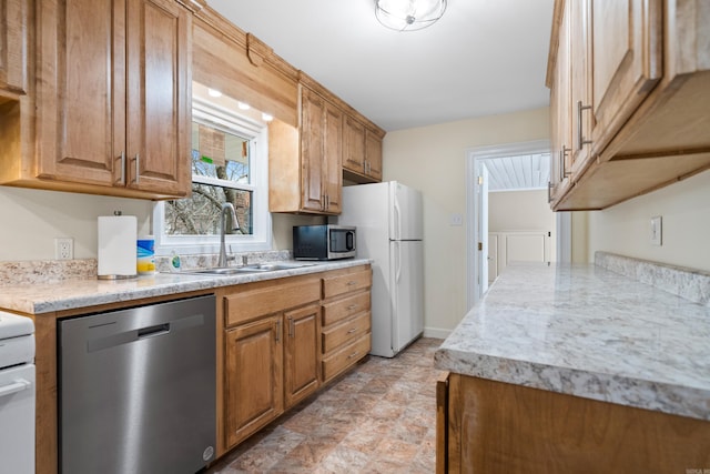 kitchen featuring appliances with stainless steel finishes and sink