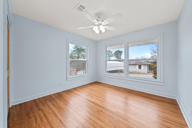 unfurnished room with ceiling fan and light hardwood / wood-style flooring