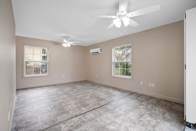 spare room with a wall mounted air conditioner, a wealth of natural light, and ceiling fan