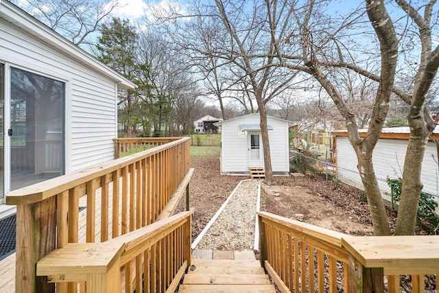 view of yard featuring a wooden deck and an outdoor structure