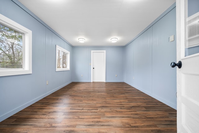 unfurnished room featuring dark hardwood / wood-style flooring