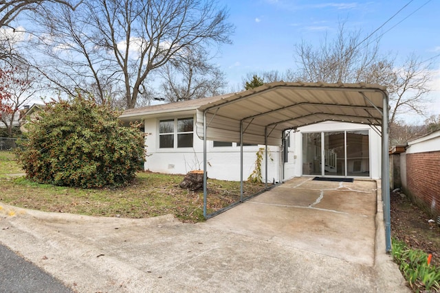 view of parking / parking lot featuring a carport