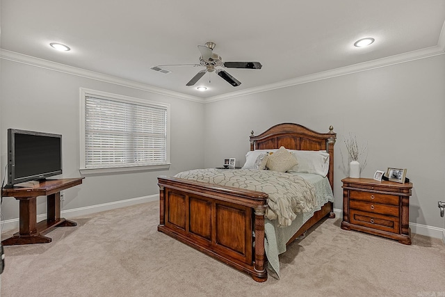 carpeted bedroom featuring ceiling fan and crown molding