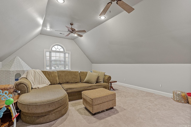 carpeted living room featuring ceiling fan and lofted ceiling