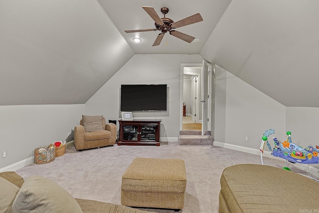 carpeted living room with vaulted ceiling and ceiling fan