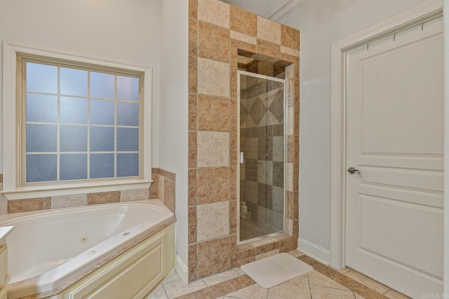 bathroom with tile patterned flooring and independent shower and bath