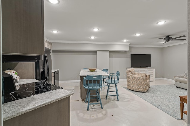 living room featuring ceiling fan and ornamental molding