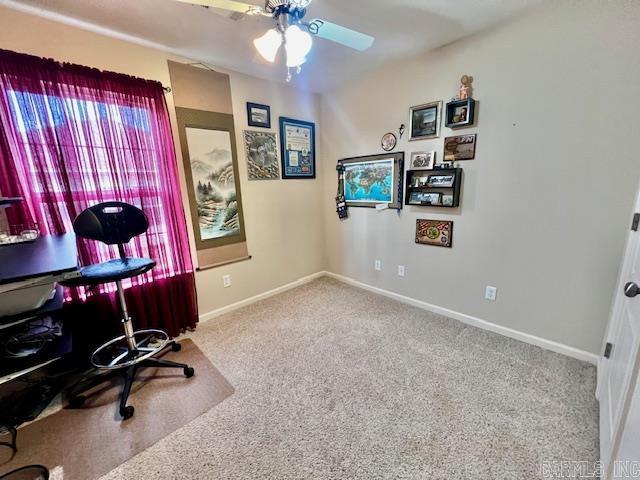 office with carpet and ceiling fan