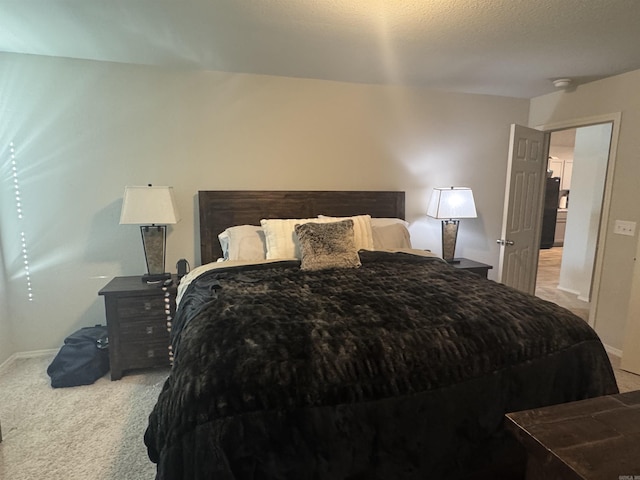 carpeted bedroom featuring a textured ceiling