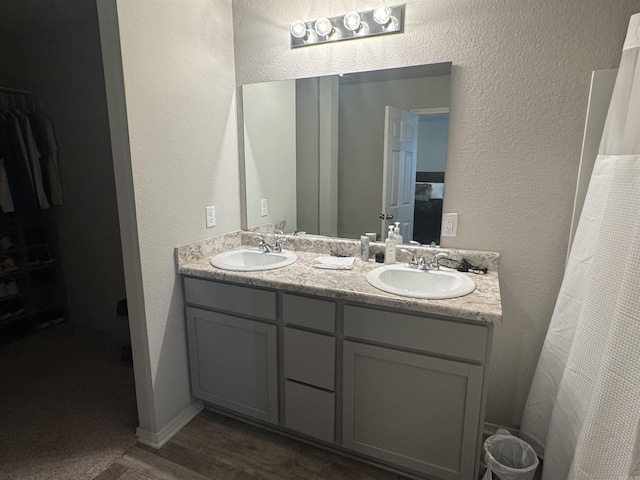 bathroom with vanity and hardwood / wood-style floors