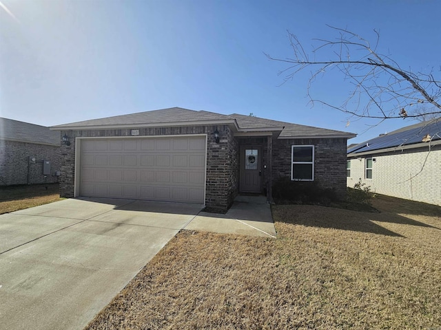 view of front of home with a garage and a front yard