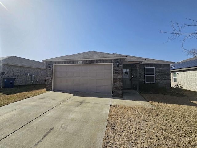 view of front of home with a garage and a front lawn