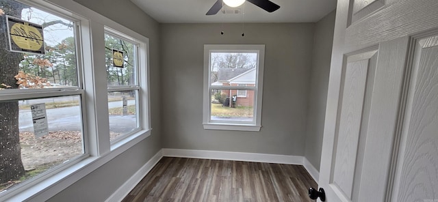 unfurnished sunroom with ceiling fan