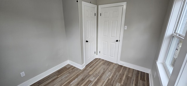 spare room with hardwood / wood-style flooring